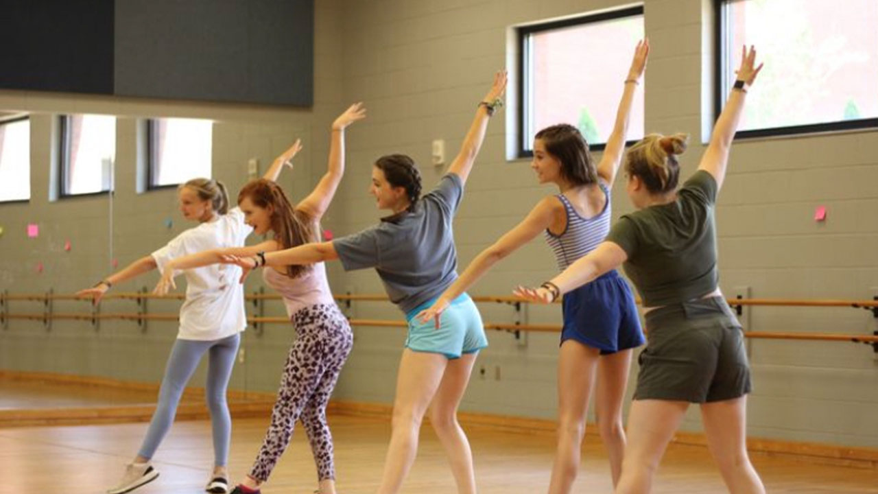 five girls dancing in dance class