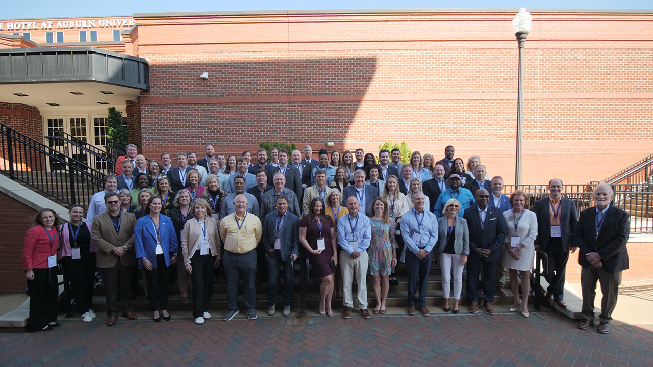 A group of people pose for a photo at the 40th anniversary of the GEDI program.