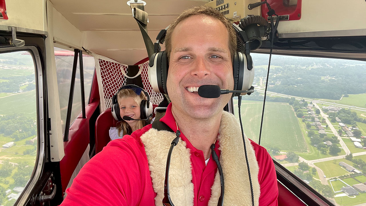 Scott Deavers flying with his daughter