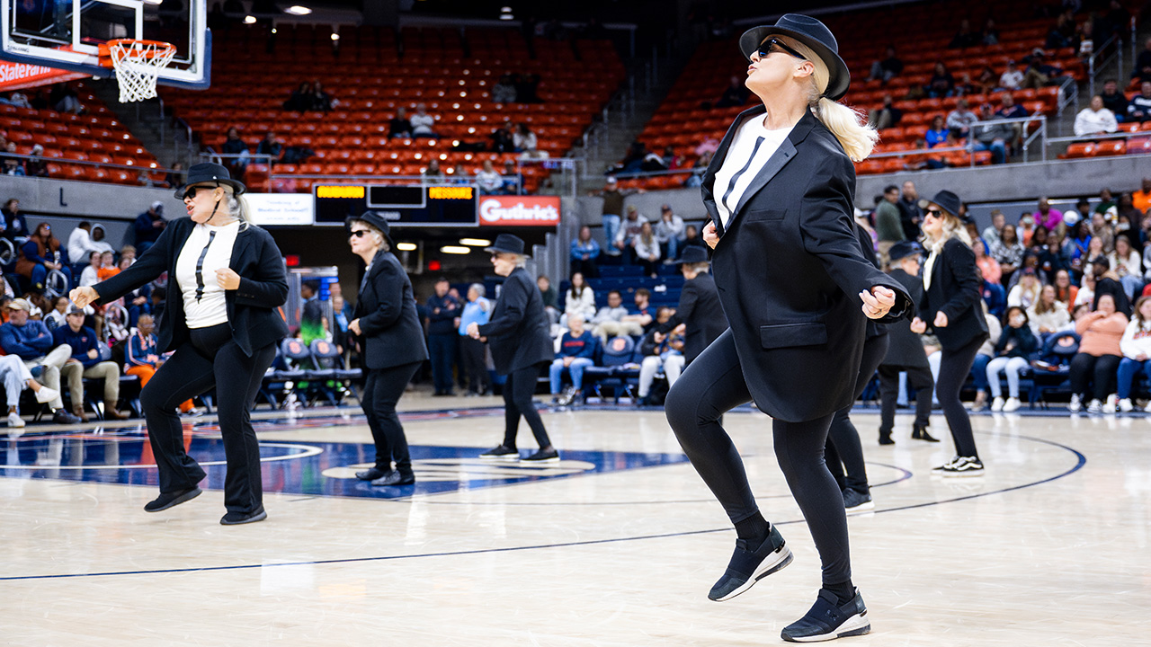 Valeri dances in a black jacket and sunglasses