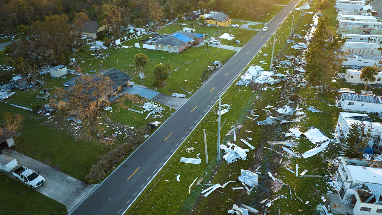 an aerial view of a mobile home neighborhood destroyed by a hurricane