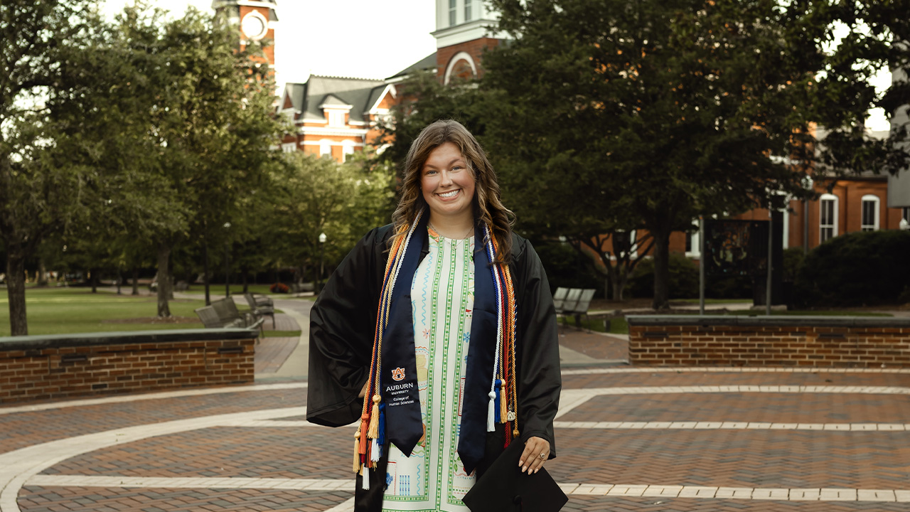 Anabel wears a cap and gown at Toomer