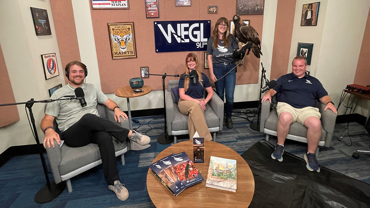three people on the podcast set