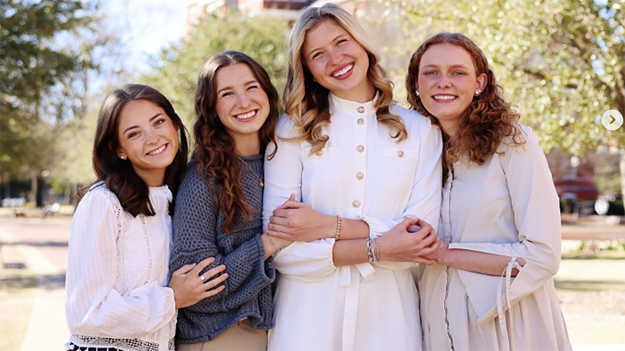four young college students pose for photos