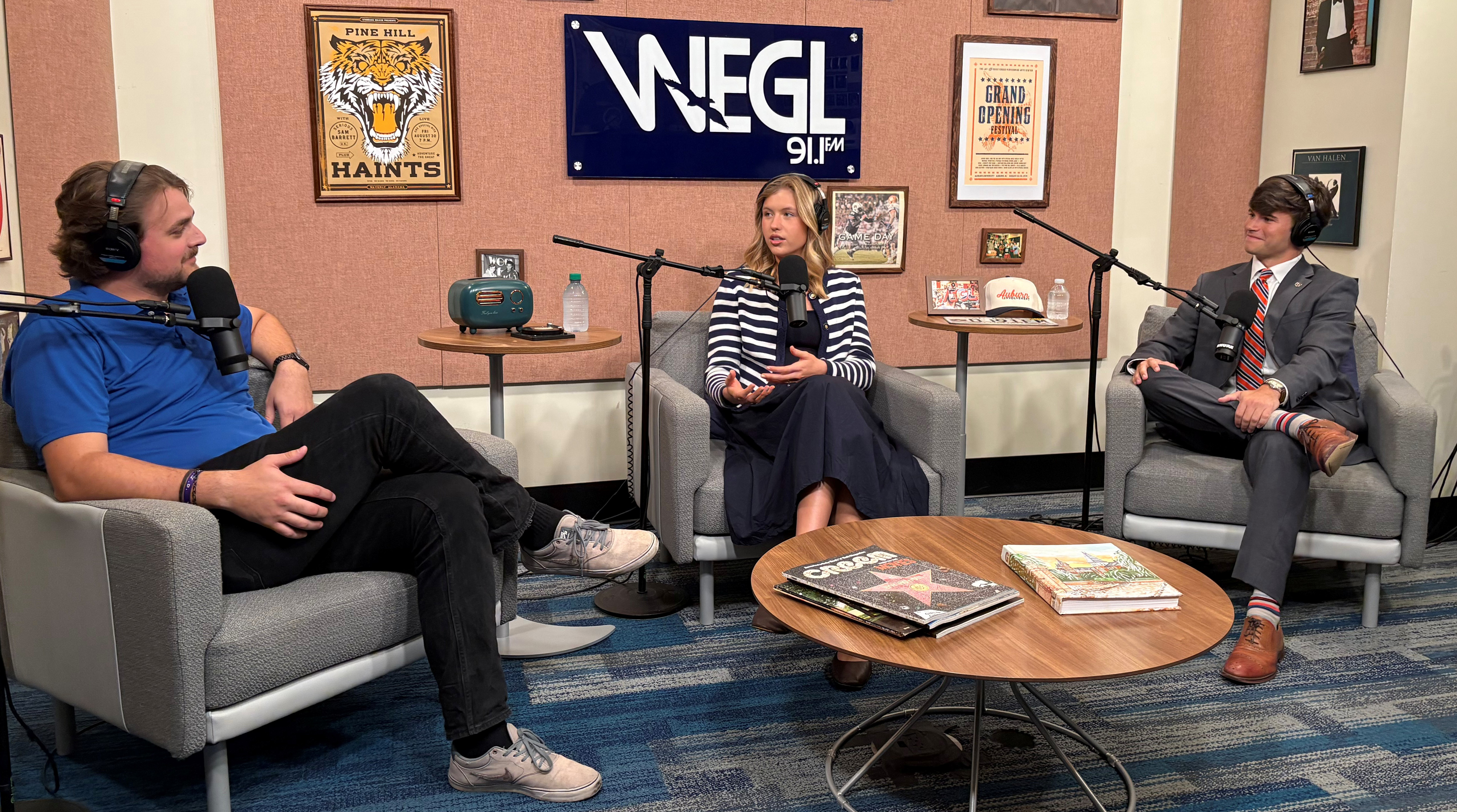 podcast host talks with two students