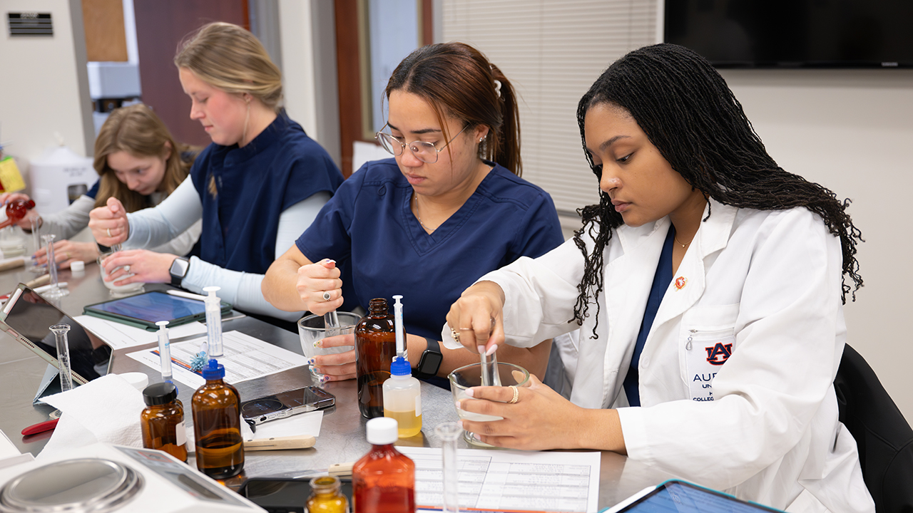 Students compounding in lab