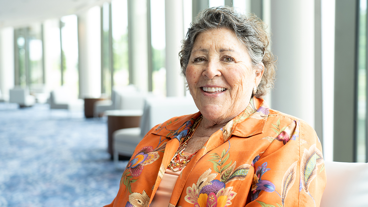 Laura Young Palmer is pictured sitting in the Gogue Performing Arts Center.