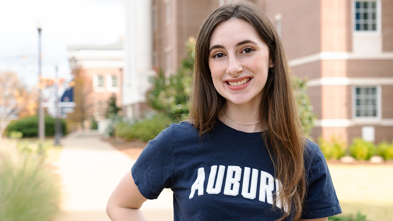 Elizabeth Hobbs is pictured in front of the Harbert College of Business campus.