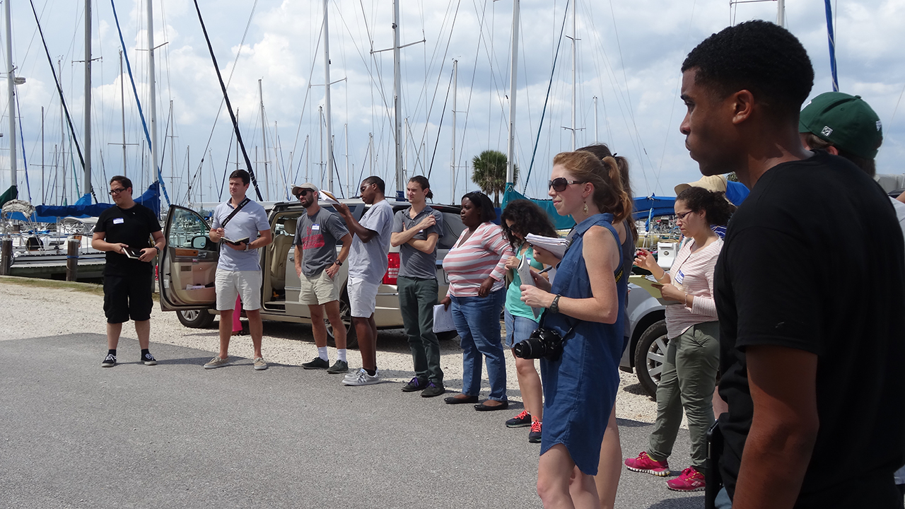 Students gathered outside near water