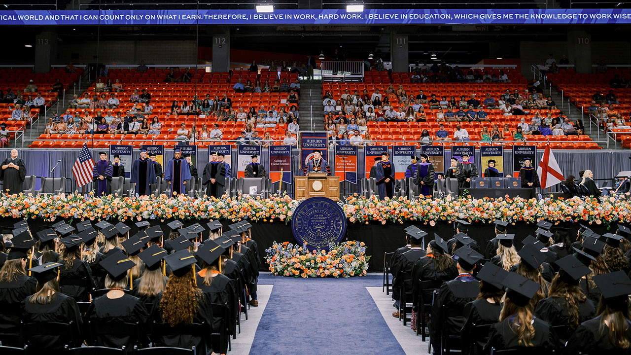 President Roberts addresses a crowd of graduates at the summer commencement ceremonies.
