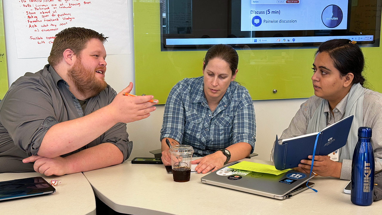 Three AUSSI participants discussing