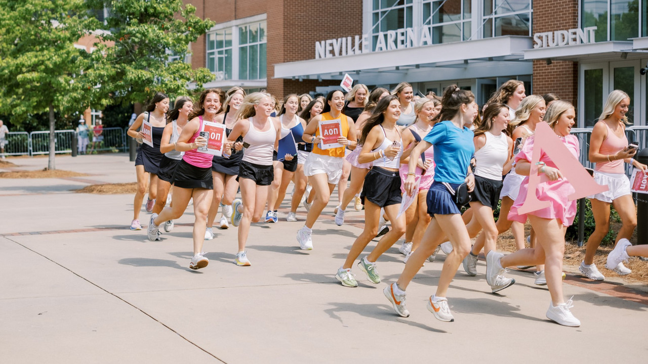 a massive crowd of female students outside, on the campus of Auburn University